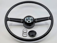 Black steering wheel with components on a white background