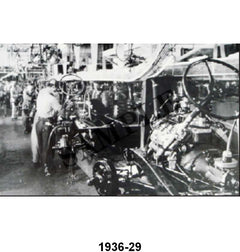 BLACK AND WHITE PICTURE - 36 PASS ASSEMBLY LINE FRAME WITH ENGINE