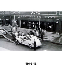 BLACK AND WHITE PICTURES - UNLOADING NEW CARS IN FRONT