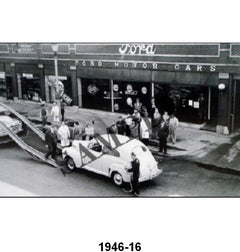 BLACK AND WHITE PICTURES - UNLOADING NEW CARS IN FRONT