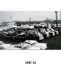 BLACK AND WHITE PICTURE - NEW '57 FORDS LOADED ON CAR