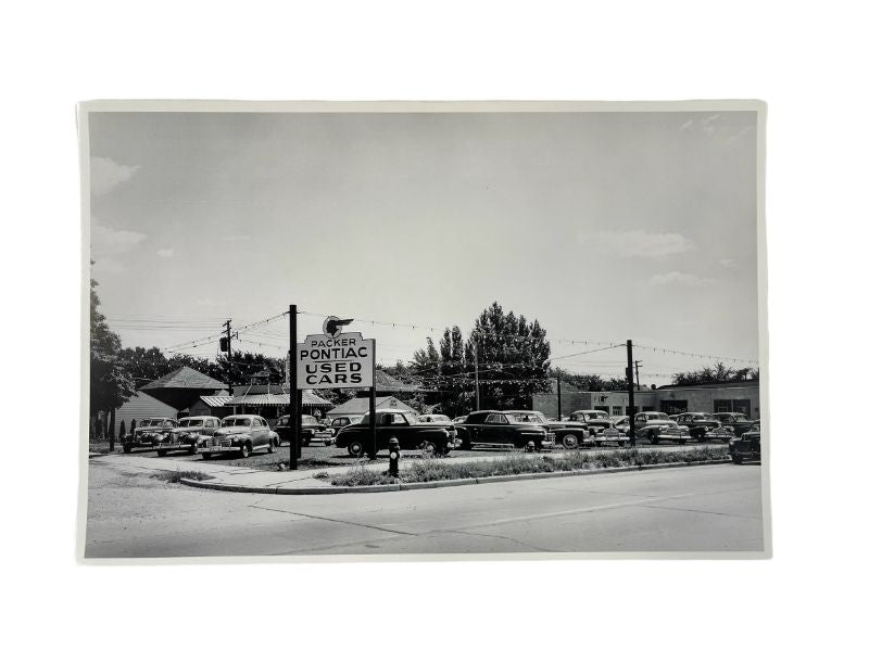 BLACK AND WHITE PICTURE - 1940'S USED CAR LOT